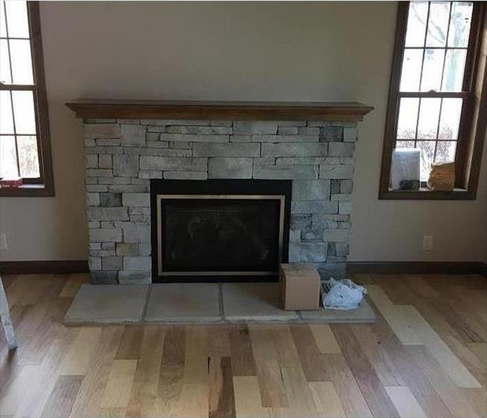 Rebuilt fireplace with no signs of previous fire damage