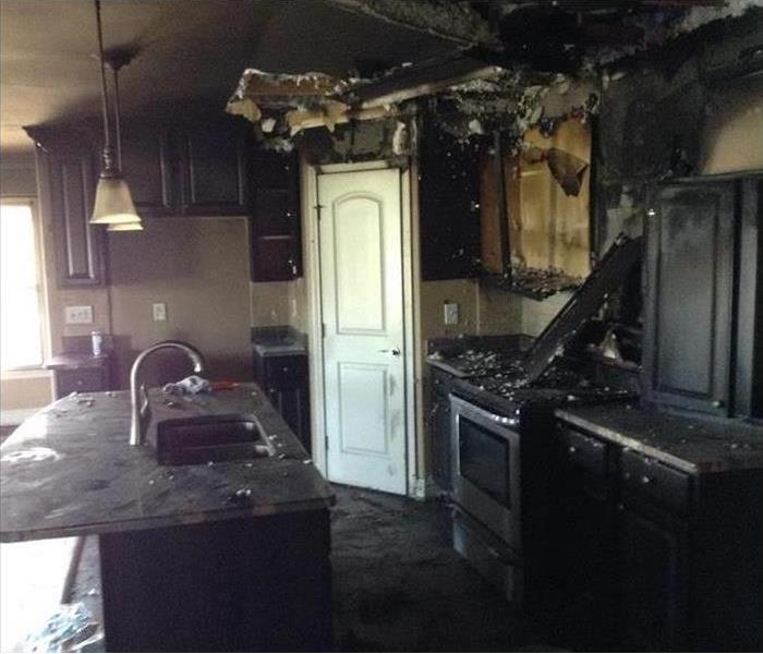 fire damaged cabinets, blackened counter top