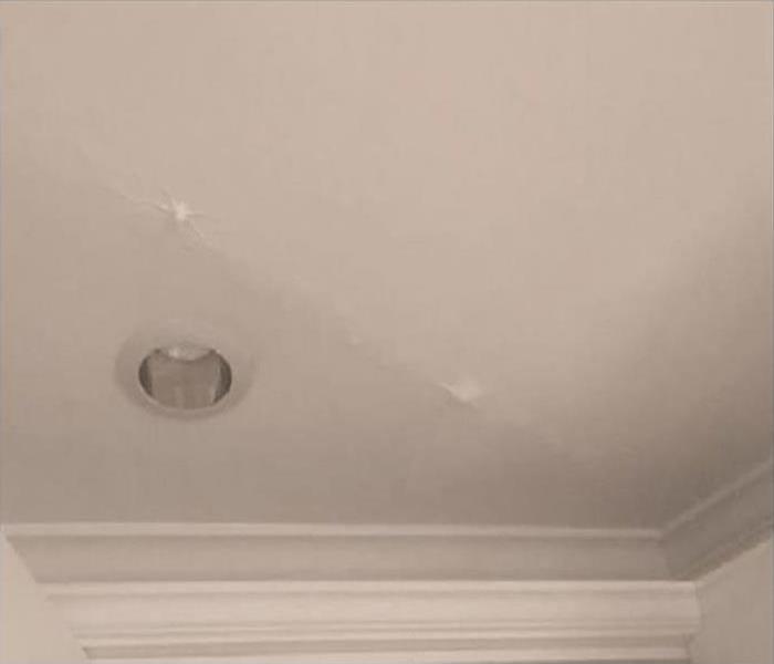 water leaking damaging ceiling