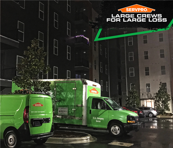 large loss servpro poster, vehicles parked night